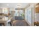 Open-concept kitchen area with stainless steel appliances, hardwood floors, and natural light at 127 Travis Hill Rd, Moncks Corner, SC 29461
