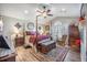Spacious main bedroom with four-poster bed, hardwood floors, and large windows at 127 Travis Hill Rd, Moncks Corner, SC 29461