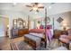 Elegant main bedroom featuring a four-poster bed, hardwood floors, and neutral paint at 127 Travis Hill Rd, Moncks Corner, SC 29461