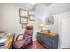 Home office features a wooden desk and leather chair with wall art and dresser against the wall at 127 Travis Hill Rd, Moncks Corner, SC 29461
