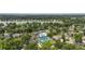 Aerial view of a neighborhood near a lake with a community pool and tennis courts at 1280 Waterfront Dr, Mount Pleasant, SC 29464