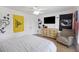 Comfortable bedroom featuring wood floors, ceiling fan, dresser and chair at 1280 Waterfront Dr, Mount Pleasant, SC 29464