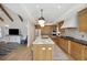Gourmet kitchen featuring a marble island with seating, wood cabinets, and seamless open-concept design at 1280 Waterfront Dr, Mount Pleasant, SC 29464