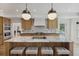 Gourmet kitchen featuring a marble island with seating, wood cabinets, and modern appliances at 1280 Waterfront Dr, Mount Pleasant, SC 29464