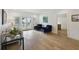 Inviting living area featuring hardwood floors, a comfortable sofa, and French doors to the outside at 1280 Waterfront Dr, Mount Pleasant, SC 29464