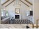 Cozy living room featuring a fireplace, vaulted ceilings with wood beams, and modern decor at 1280 Waterfront Dr, Mount Pleasant, SC 29464