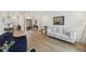 Open-concept living room with hardwood floors, French doors and stylish furniture at 1280 Waterfront Dr, Mount Pleasant, SC 29464