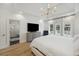 Bright main bedroom features a walk-in shower, tray ceiling, chandelier, TV, and backyard views at 1280 Waterfront Dr, Mount Pleasant, SC 29464