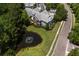 Birds-eye view of apartments around a pond with a fountain surrounded by mature trees at 1335 Hopton Cir # 1335, Mount Pleasant, SC 29466