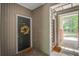 Welcoming entryway with a dark door, decorative wreath, and doormat at 1335 Hopton Cir # 1335, Mount Pleasant, SC 29466