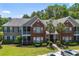 Attractive multi-story condo building with brick and siding exterior and well-manicured lawn at 1335 Hopton Cir # 1335, Mount Pleasant, SC 29466
