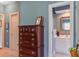 Hallway with a view of a dresser and a partial view of a bathroom with dual sinks at 1335 Hopton Cir # 1335, Mount Pleasant, SC 29466