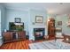 Cozy living room with a fireplace, entertainment center, and comfortable seating at 1335 Hopton Cir # 1335, Mount Pleasant, SC 29466