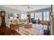 Spacious living room with hardwood floors, comfortable seating, and large windows at 1335 Hopton Cir # 1335, Mount Pleasant, SC 29466