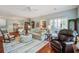 Open-concept living space with hardwood floors, cozy furniture, and access to outdoor area at 1335 Hopton Cir # 1335, Mount Pleasant, SC 29466