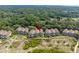Aerial view of cozy townhomes near beach, surrounded by lush green foliage at 1376 Pelican Watch Villas, Seabrook Island, SC 29455