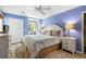 Bright and airy bedroom with blue walls, a comfortable bed, and ample natural light, creating a relaxing ambiance at 1376 Pelican Watch Villas, Seabrook Island, SC 29455