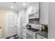 Functional kitchen featuring white appliances, ample cabinetry, and durable granite countertops, perfect for meal preparation at 1376 Pelican Watch Villas, Seabrook Island, SC 29455