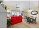 Cozy living room with vaulted ceilings and views of the ocean from the sliding door at 1376 Pelican Watch Villas, Seabrook Island, SC 29455
