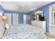 Charming blue bedroom featuring a white dresser, coastal decor, and a bright window at 1376 Pelican Watch Villas, Seabrook Island, SC 29455