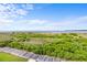 Expansive ocean view from a high vantage point with lush greenery below at 1376 Pelican Watch Villas, Seabrook Island, SC 29455