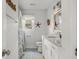Cozy bathroom design with patterned tile, updated lighting, and framed mirror at 1445 Downwood Pl, Charleston, SC 29412