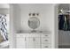 Nicely updated bathroom features shiplap walls, marble countertop and bright vanity lighting at 1445 Downwood Pl, Charleston, SC 29412