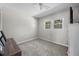 Empty bedroom with carpet and a small window at 1445 Downwood Pl, Charleston, SC 29412