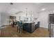 Bright, open-concept kitchen with a central island, stainless appliances, and hardwood floors at 1445 Downwood Pl, Charleston, SC 29412