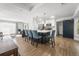 Bright, open-concept kitchen with a central island, stainless appliances, and a sliding barn door at 1445 Downwood Pl, Charleston, SC 29412