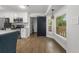 Bright kitchen area with a central island, stainless appliances, hardwood floors, and a bay window at 1445 Downwood Pl, Charleston, SC 29412