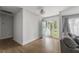 Inviting living room featuring hardwood floors, a Dutch door, and a flood of natural light at 1445 Downwood Pl, Charleston, SC 29412