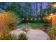 Cozy backyard featuring string lights and a fire pit on a lush green lawn at 152 Candace Dr, Ridgeville, SC 29472