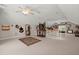 Spacious bonus room on upper level, featuring an ornate rug, high ceilings and ceiling fans at 152 Candace Dr, Ridgeville, SC 29472