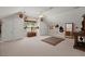 Finished bonus room upstairs with carpet, ceiling fan, and a large window for natural light at 152 Candace Dr, Ridgeville, SC 29472
