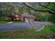 Secluded home and detached garage surrounded by mature trees, plus a relaxing hammock at 152 Candace Dr, Ridgeville, SC 29472