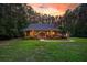 Lovely brick home featuring a manicured lawn, and a welcoming front porch at 152 Candace Dr, Ridgeville, SC 29472