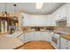 Bright kitchen featuring white cabinetry, stainless steel appliances, and hardwood floors at 152 Candace Dr, Ridgeville, SC 29472