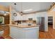 Bright kitchen with white cabinets, stainless steel appliances, and a breakfast bar at 152 Candace Dr, Ridgeville, SC 29472