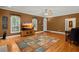 Comfortable living room with hardwood floors, a decorative rug, and large windows for natural light at 152 Candace Dr, Ridgeville, SC 29472
