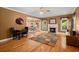 Spacious living room featuring a fireplace, hardwood floors, and an open view into the dining area at 152 Candace Dr, Ridgeville, SC 29472