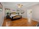 Spacious bedroom with hardwood floors and a view to the Primary bath at 152 Candace Dr, Ridgeville, SC 29472