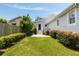 Backyard featuring a concrete patio, lush lawn, tasteful landscaping, and outdoor lighting for enjoyable gatherings at 158 Darlington Ave, Charleston, SC 29403