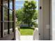 This backyard features a lush green lawn and a wooden fence at 158 Darlington Ave, Charleston, SC 29403