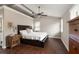 This bedroom has hardwood floors, a dark wood bed, and ample natural light at 158 Darlington Ave, Charleston, SC 29403