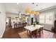 Open dining area with a modern chandelier, seamlessly connected to the kitchen and living spaces at 158 Darlington Ave, Charleston, SC 29403