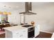 Stylish kitchen island with seating, built-in oven, and a modern range hood, ideal for entertaining at 158 Darlington Ave, Charleston, SC 29403