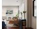 Cozy living room with a decorative fireplace, hardwood floors, and an abundance of natural light at 158 Darlington Ave, Charleston, SC 29403