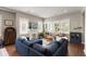 Comfortable living room featuring a brick fireplace, plenty of natural light, and stylish decor at 158 Darlington Ave, Charleston, SC 29403