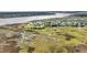 Breathtaking aerial view of waterfront homes surrounded by lush marshland and a wide river at 166 River Breeze Dr, Charleston, SC 29407